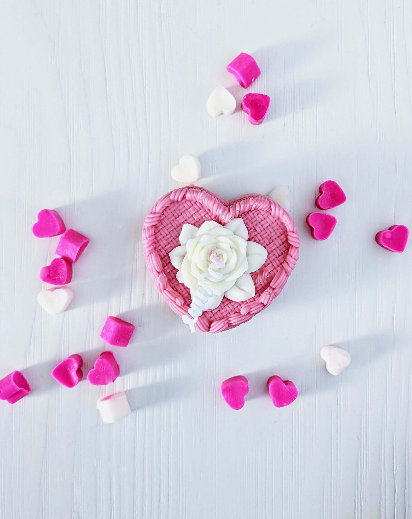 Handmade soy heart-shaped candle with rose detail