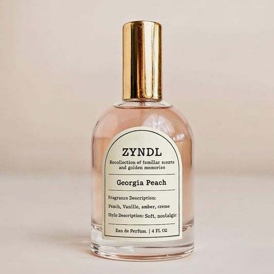 Peach perfume bottle labeled 'ZYNDL Georgia Peach' on a beige background